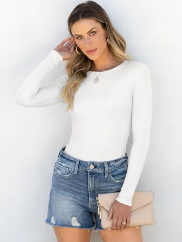 Model wearing ANRABESS long sleeve top tucked into jeans