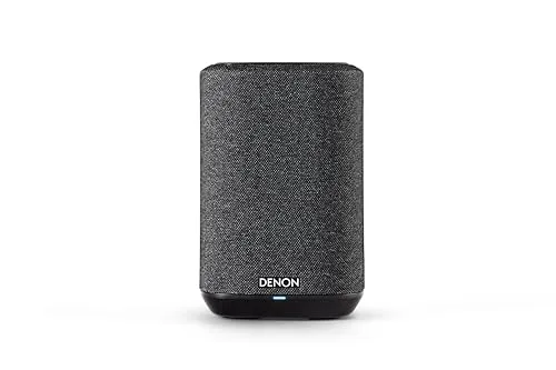 Front view of Denon Home 150 NV wireless speaker on a wooden surface