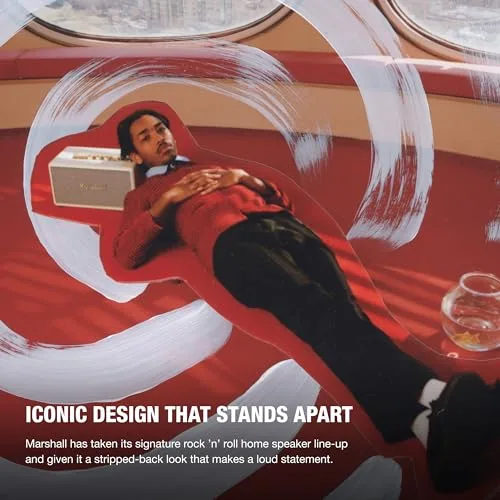 Speaker shown next to a vinyl record player, connected via RCA cable